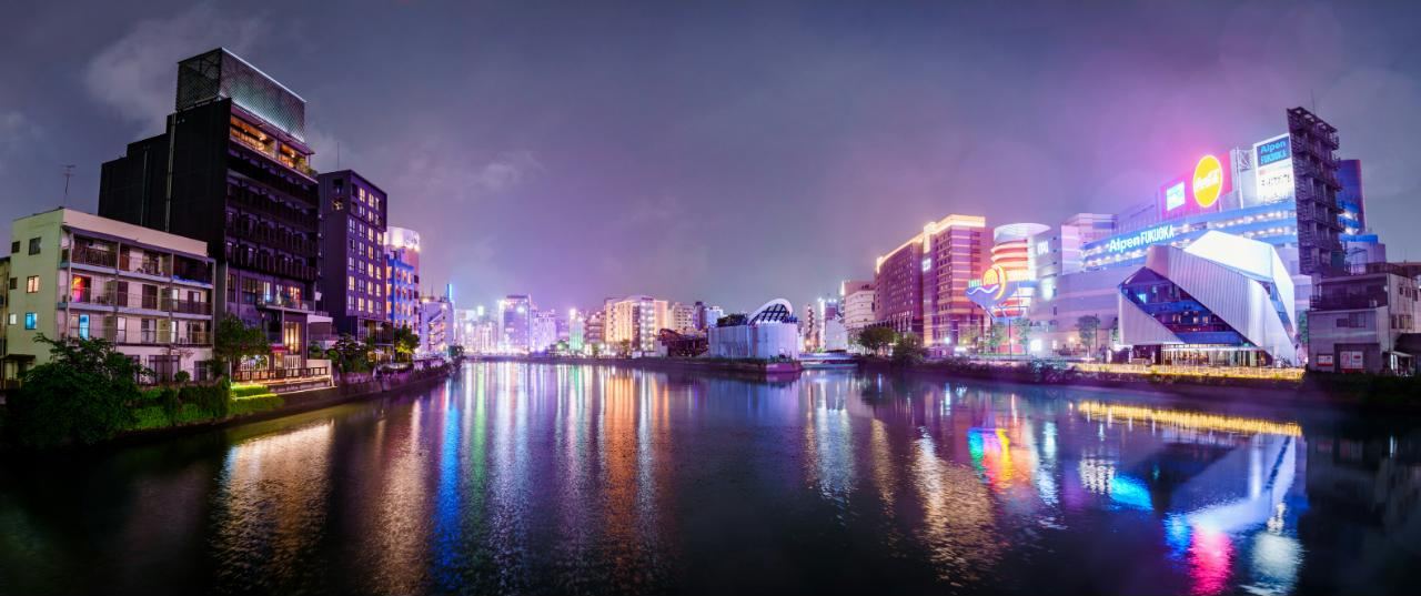 The neon-lit skyline around Canal City Hakata reflected in the Naka River at night, Fukuoka